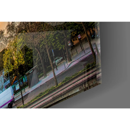 Tilted Eiffel Tower sunset glass wall art with urban trees and vehicles