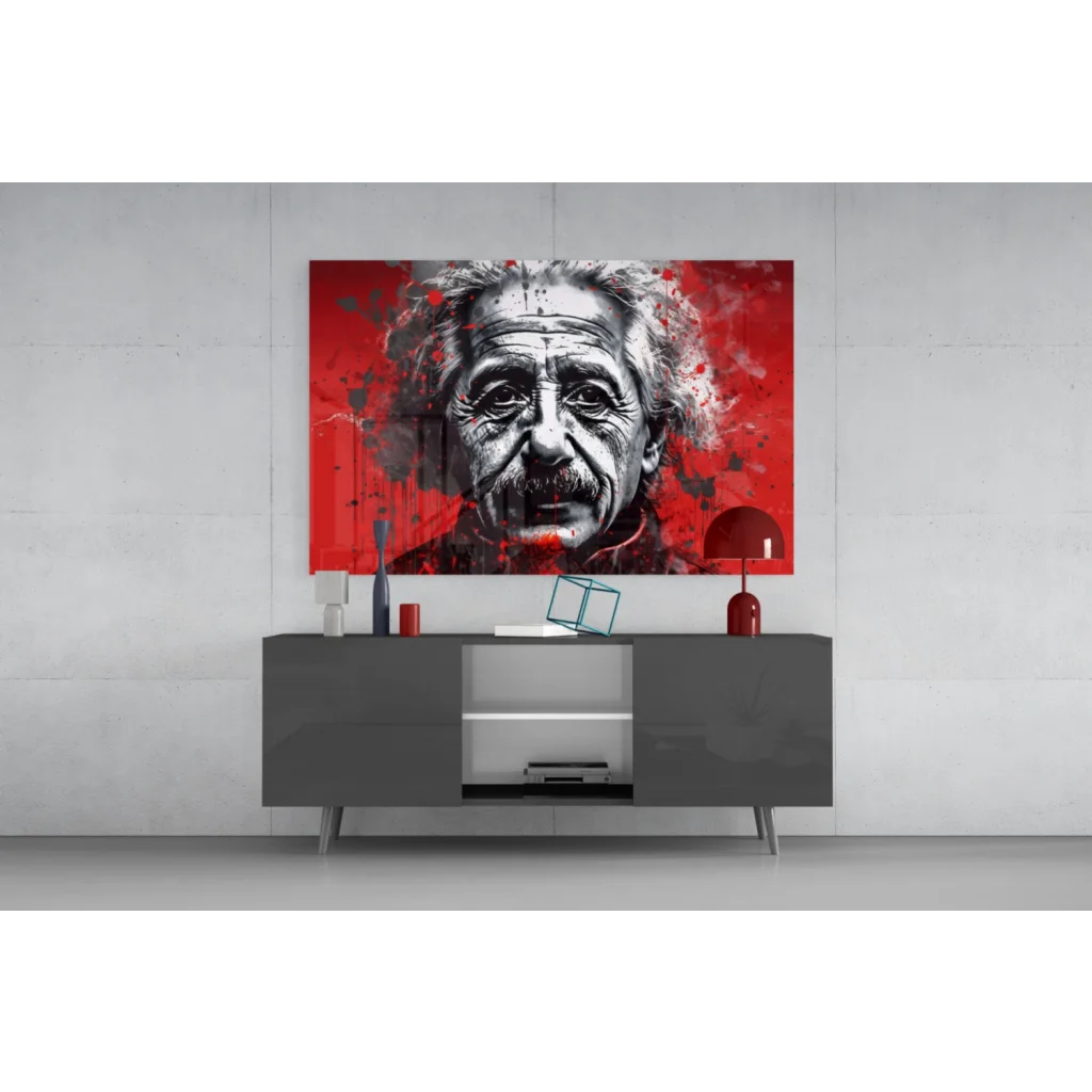 Bold red and black Einstein splatter wall art portrait above gray console
