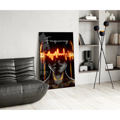 Modern black leather couch with textured surface and electric orange soundwave glass wall art