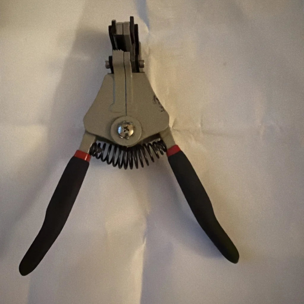 Gray electrical wire stripper tool type B with black handles, red accents