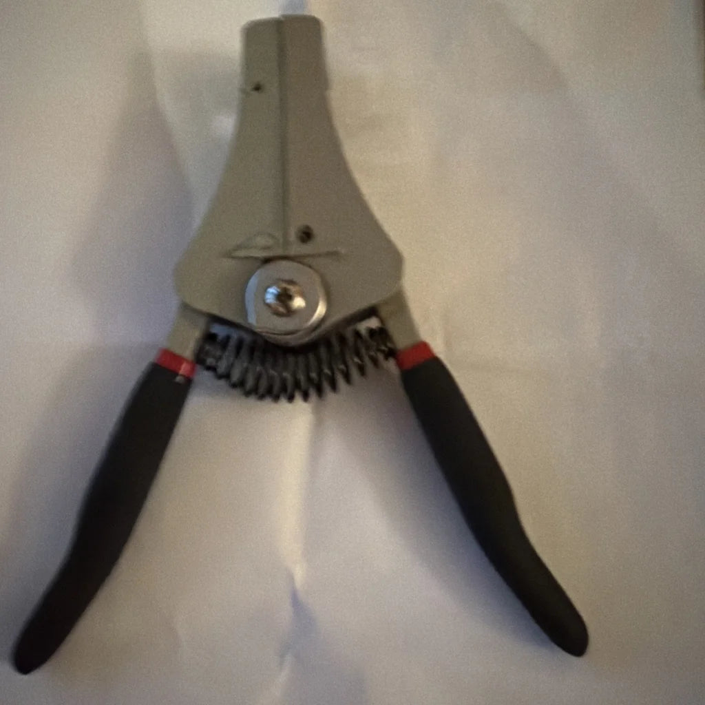 Gray electrical wire stripper tool type B with black handles, red accents