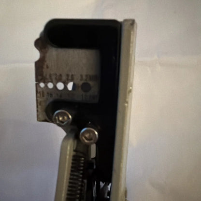 Rusty back of electrical wire stripper tool type B with screws and spring