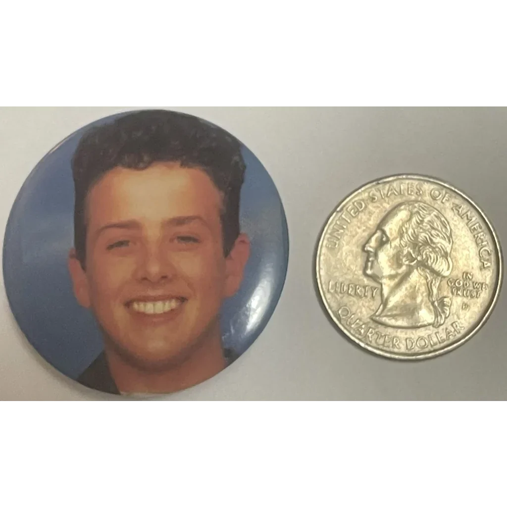 Smiling young man in Electrifying Joey Close Vintage New Kids on the Block Pin