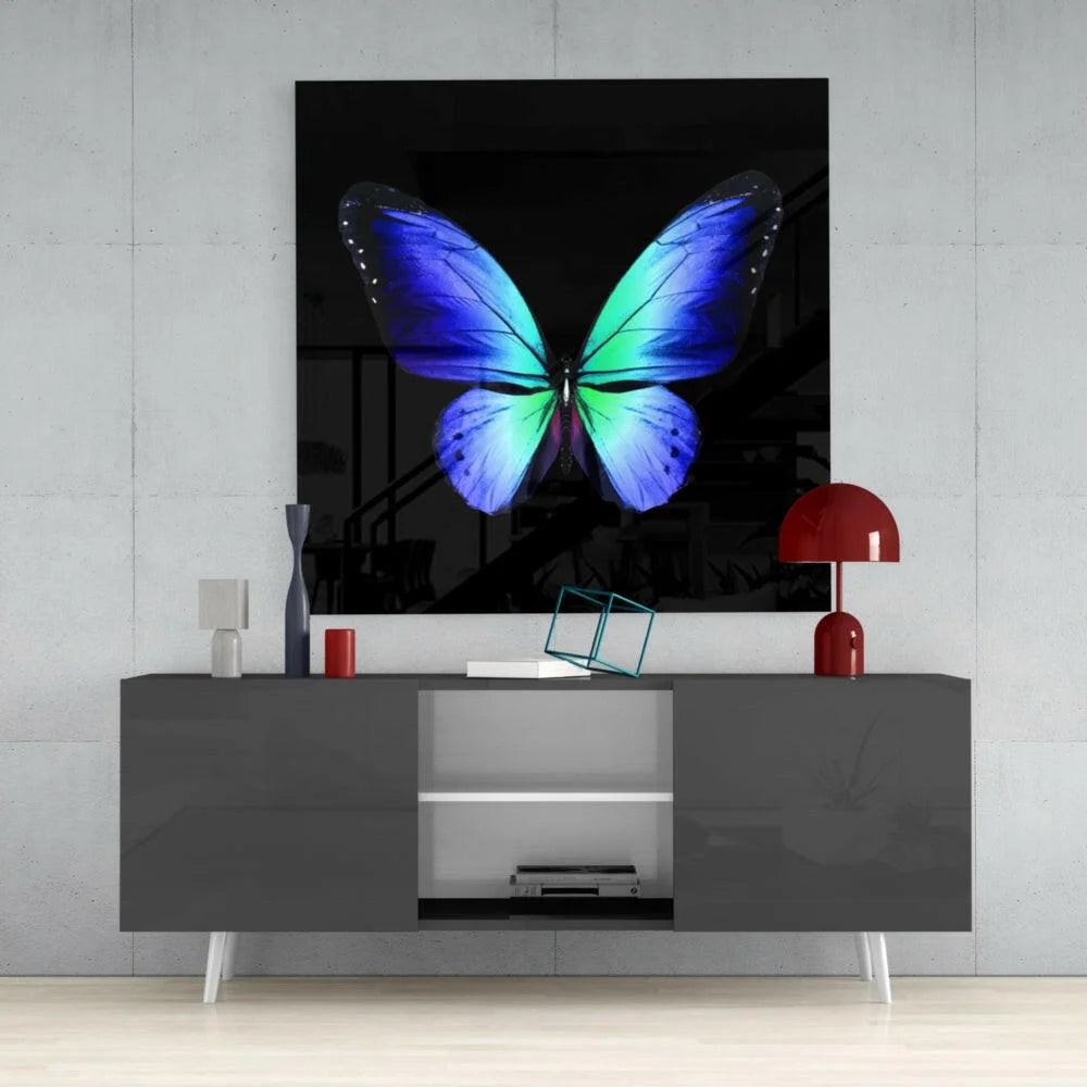 Vibrant blue green butterfly glass wall art on glossy black canvas