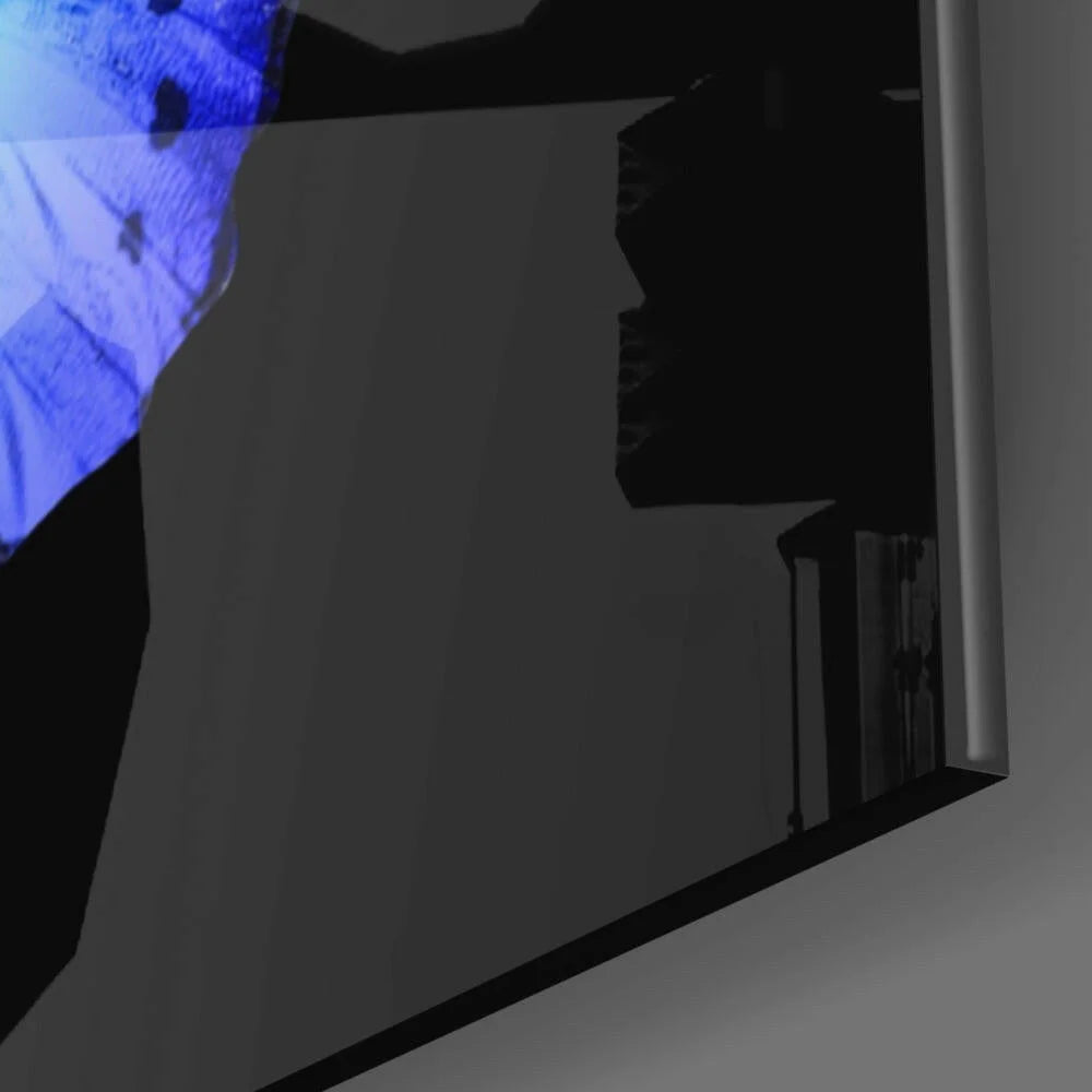 Stunning butterfly glass wall art with blue-lit reflection