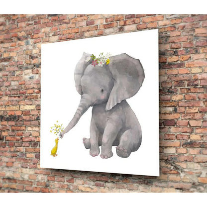 Gray baby elephant with floral crown offers flowers to yellow duck in glass wall art