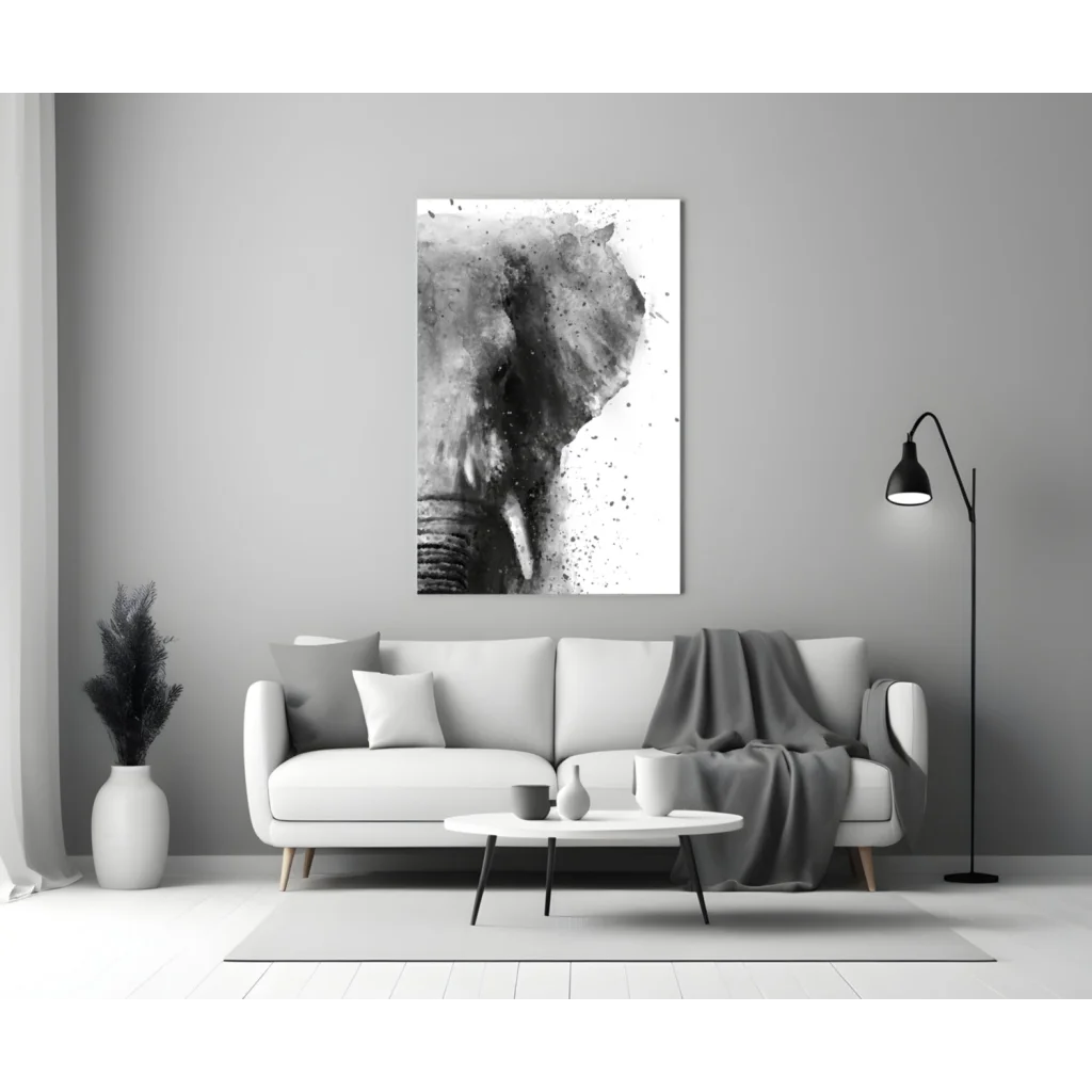 Black-and-white abstract elephant glass wall art above white sofa