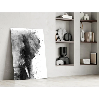 Black and white abstract elephant glass wall art print leaning against wall