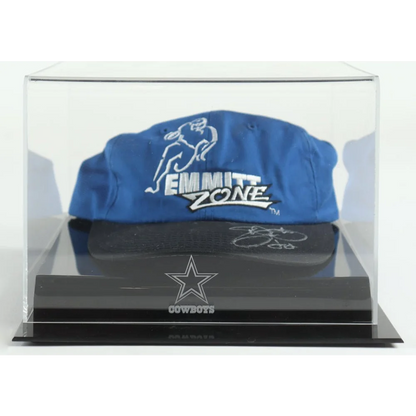 Blue Dallas Cowboys cap signed by Emmitt Smith inside a clear display case