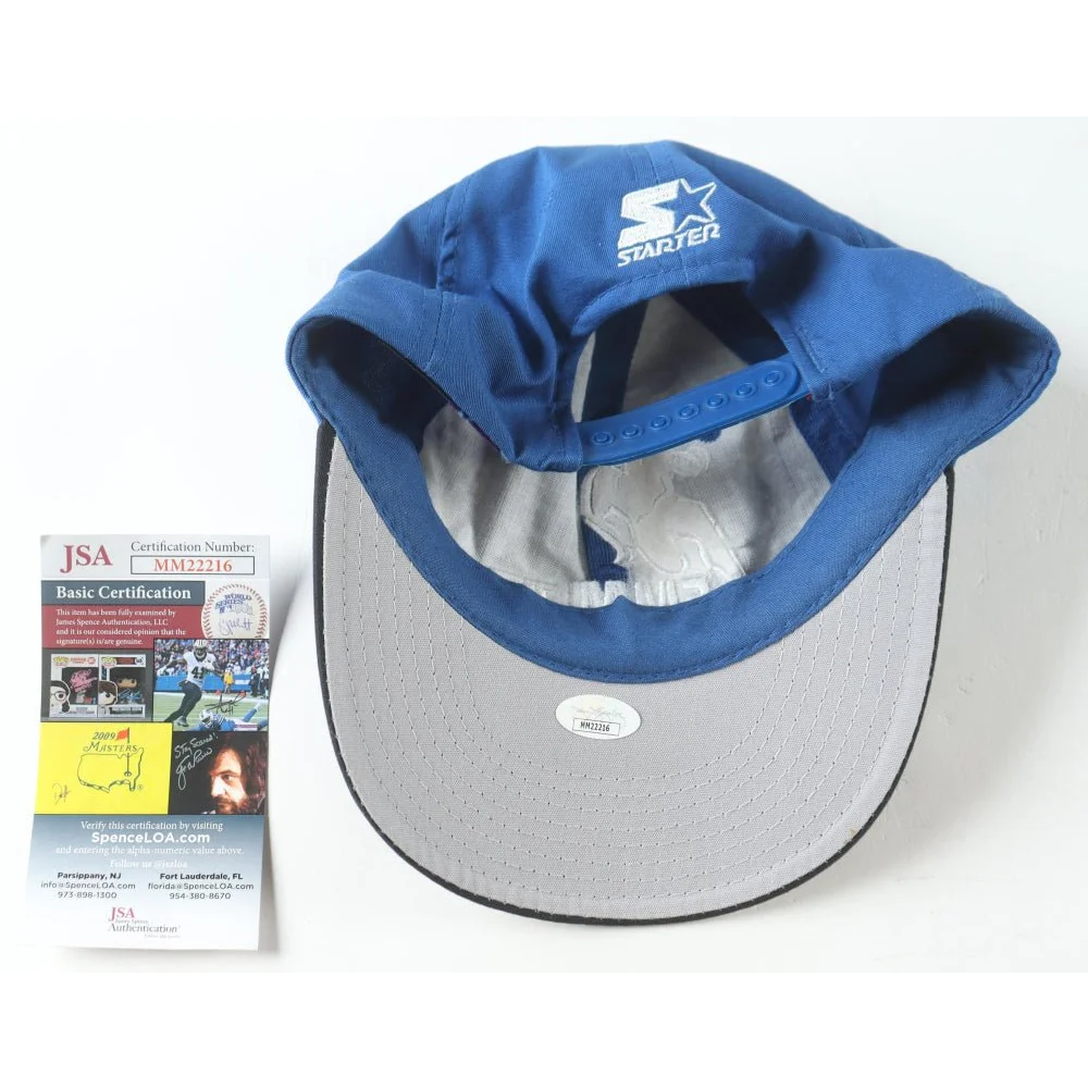 Blue Dallas Cowboys starter cap signed by Emmitt Smith in display case