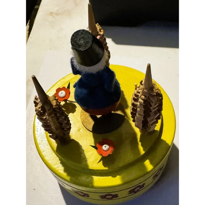 Yellow Reuge music box with gnome and wooden trees from Enchanting Reuge Music Box Soldier