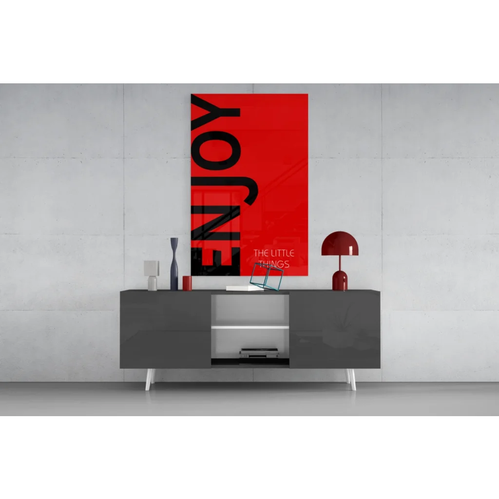 Vibrant red wall art canvas with bold black enjoy text and little things below