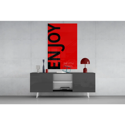 Vibrant red wall art canvas with bold black enjoy text and little things below