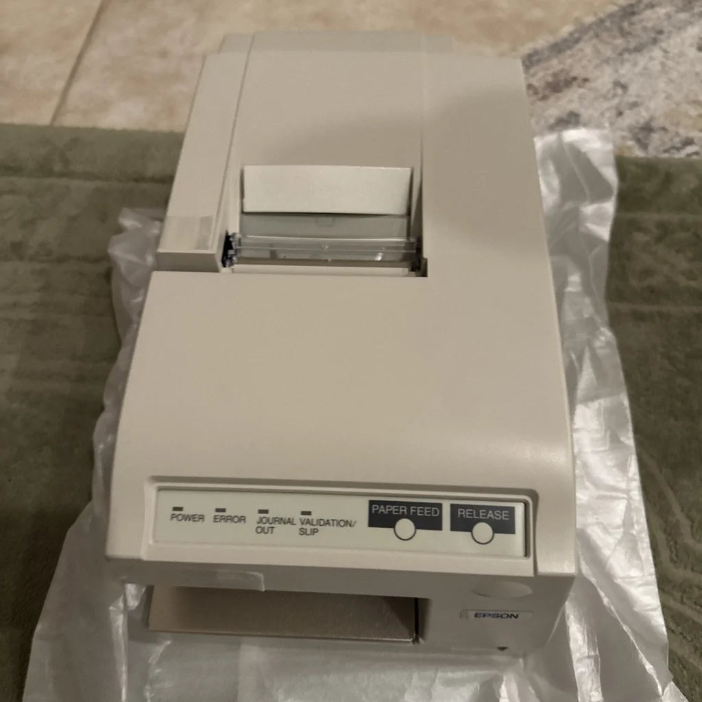Beige Epson TM-U375P dot matrix POS receipt printer with compact design