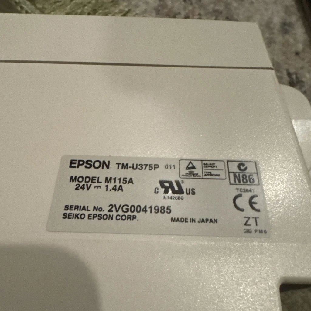 Back of white Epson TM-U375P matrix POS receipt printer model M115A 24V