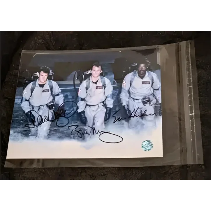 Ernie Hudson Ghostbusters signed 8x10 photo with three men in ghostbusters costumes in sleeve