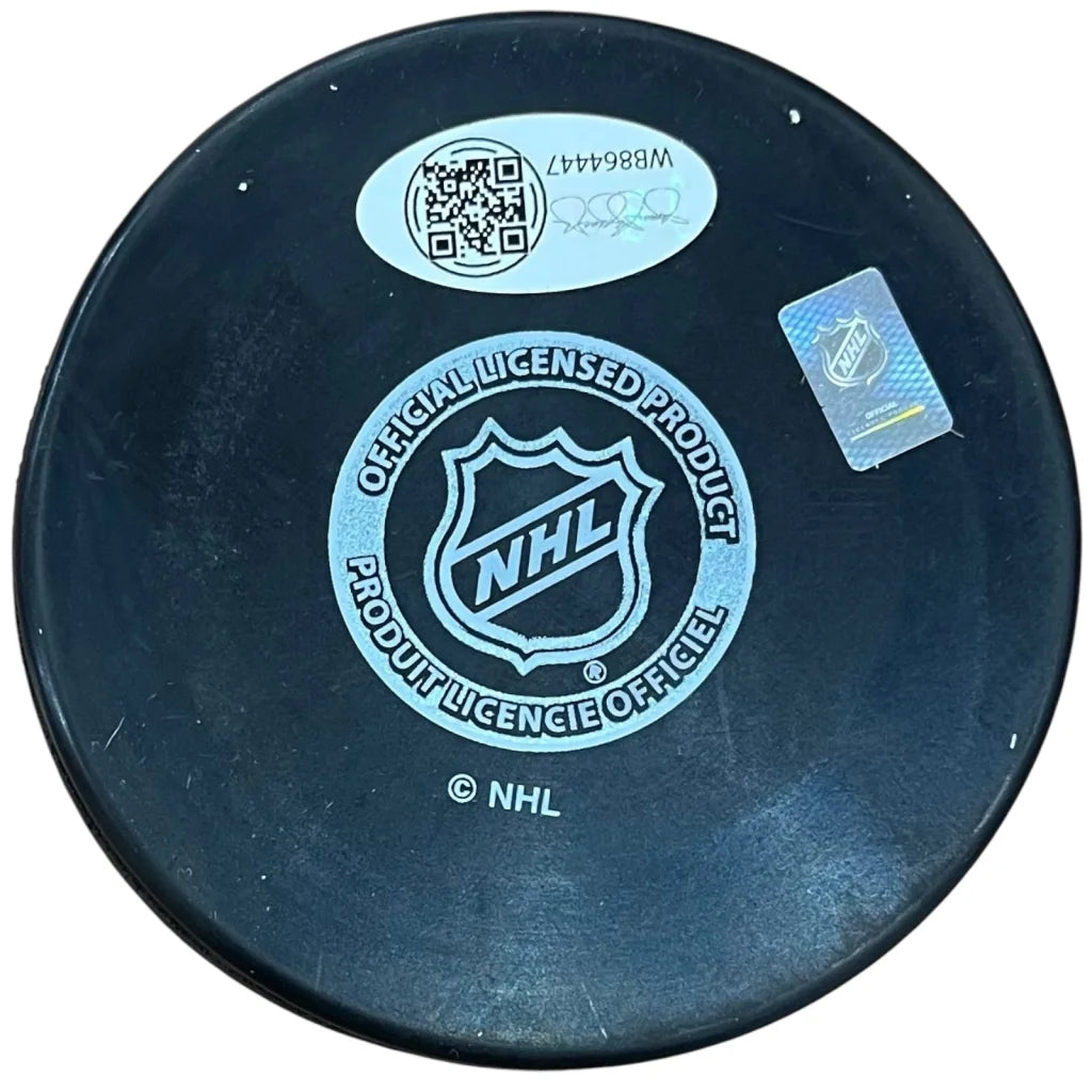Evan Rodrigues autographed black NHL hockey puck with white logo