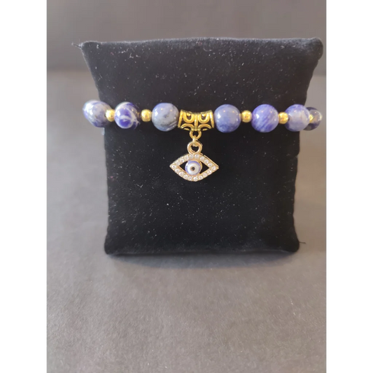 Evil eye charm sodalite beaded bracelet with lavender beads and gold accents