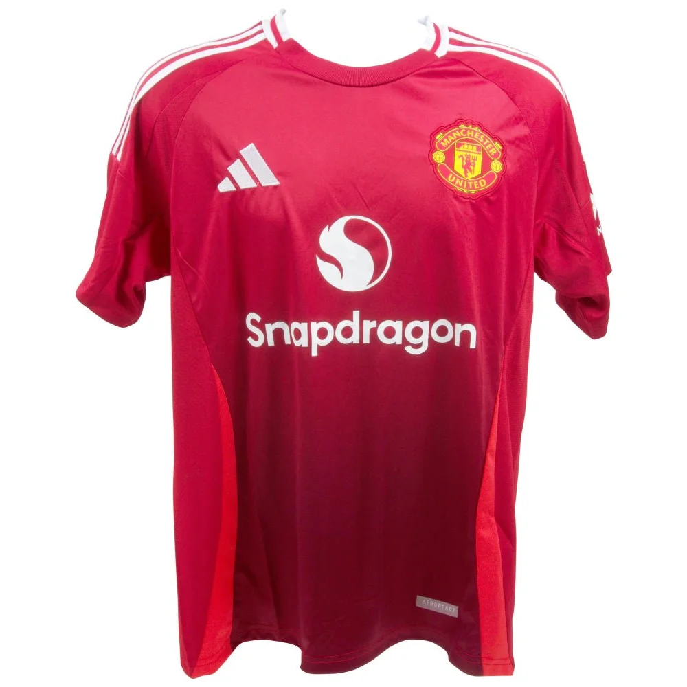 Signed Manchester United jersey featuring red short sleeves and white accents