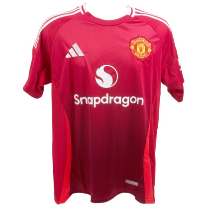 Signed Manchester United jersey featuring red short sleeves and white accents