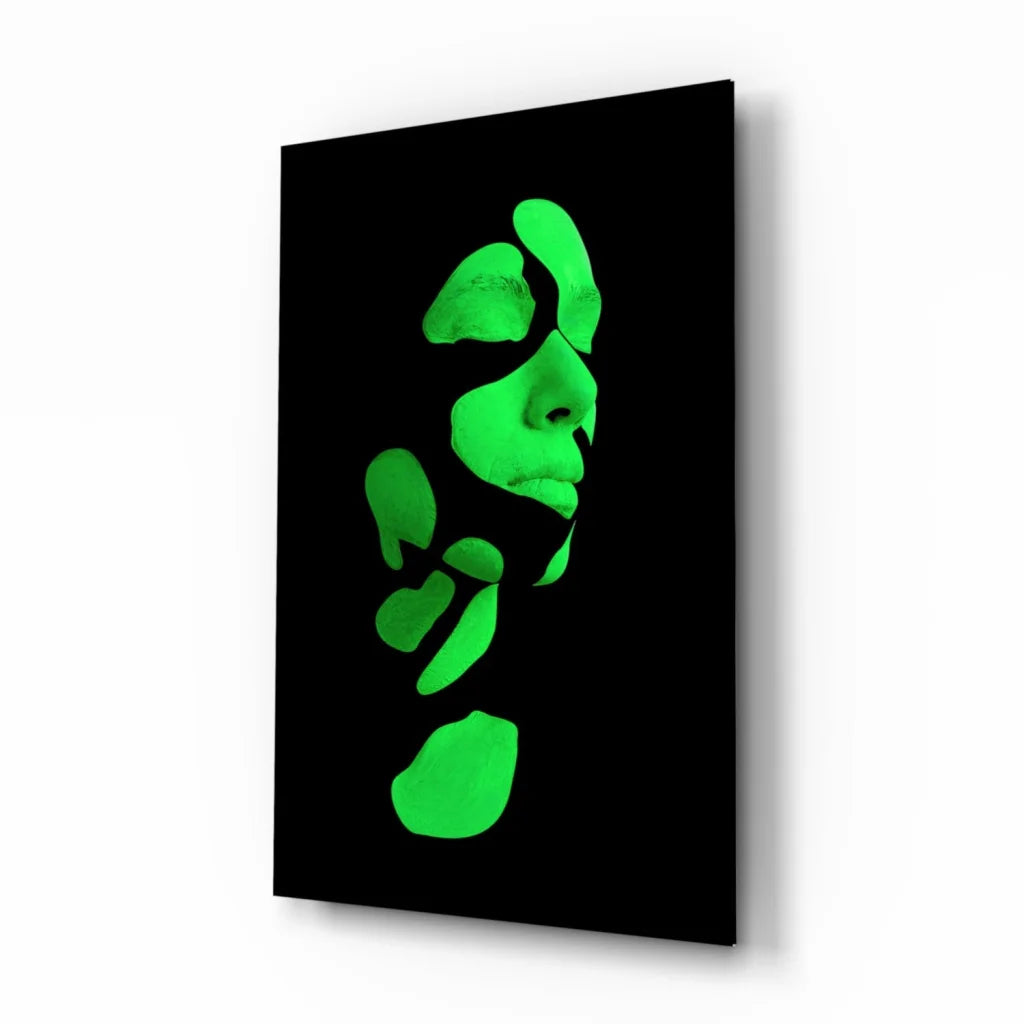 Glowing green abstract face on black glass wall art canvas
