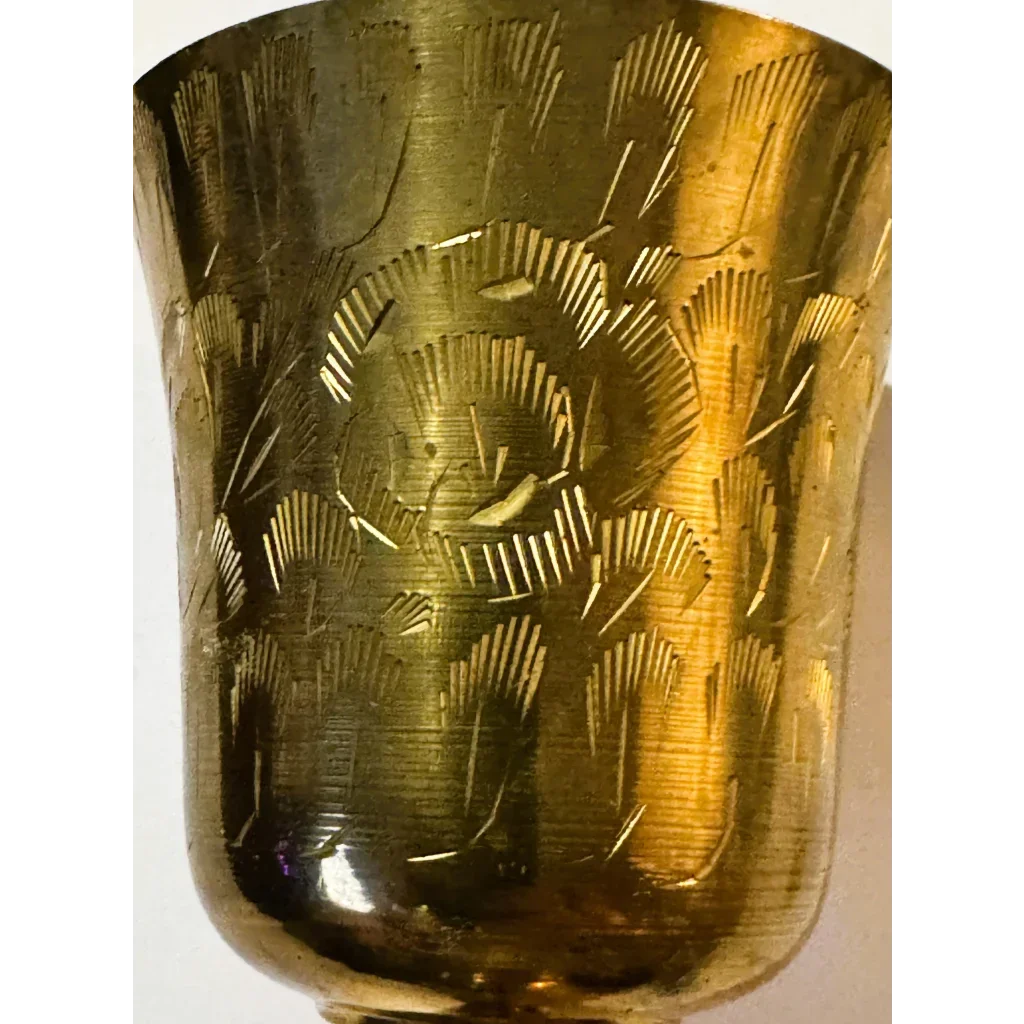 Beautiful engraved golden brass chalice showcasing Middle Eastern floral designs