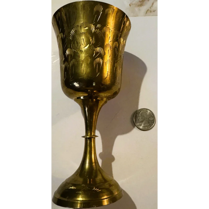 Ornate Middle Eastern brass chalice with floral engravings, perfect for collectors