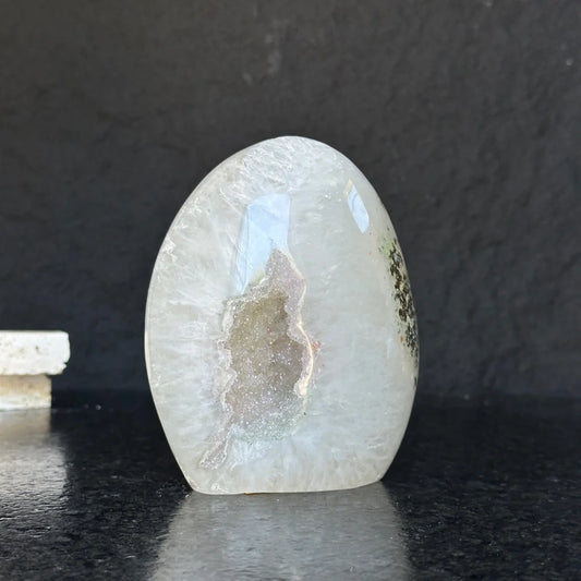 Extra large quartz geode with sparkling crystals and greenish inclusions