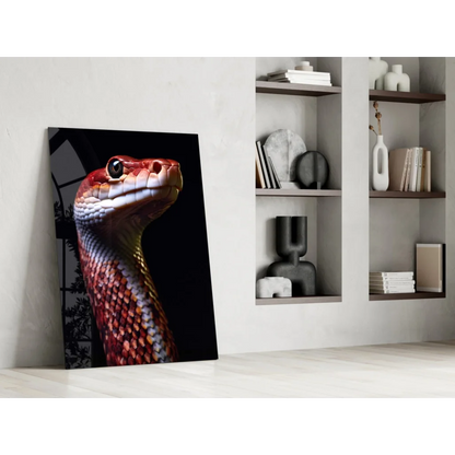 Vibrant red snake glass wall art portrait leaning on wall