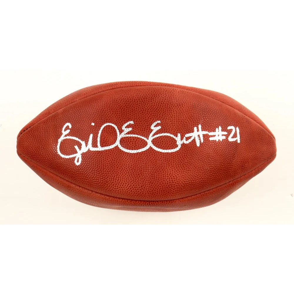 Brown leather Duke NFL football with white autograph, perfect for NFL football fans
