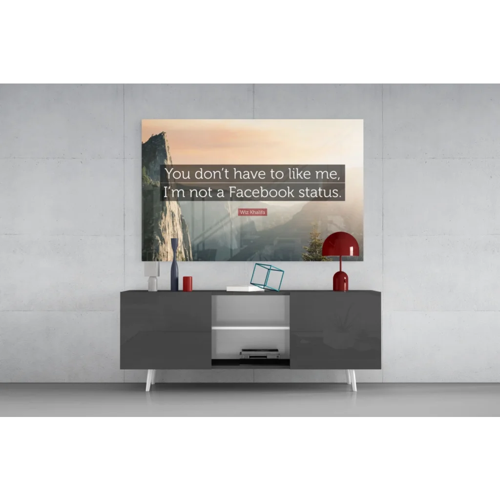 Modern gray console table with white legs and open shelving under Wiz Khalifa mountain sunset wall art