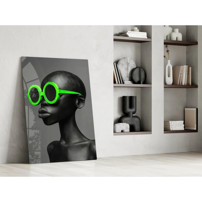 Stylized black-and-white woman portrait on glass wall art with neon green sunglasses