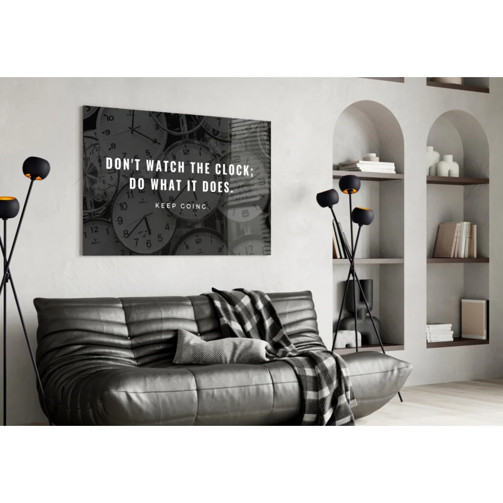 Black and white glass wall art with motivational clock quote