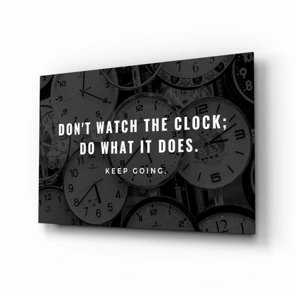 Black and white glass wall art print of overlapping clocks with motivational quote do what it does