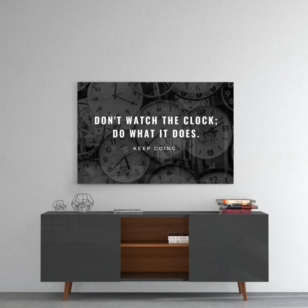 Black and white glass wall art with motivational clock quote