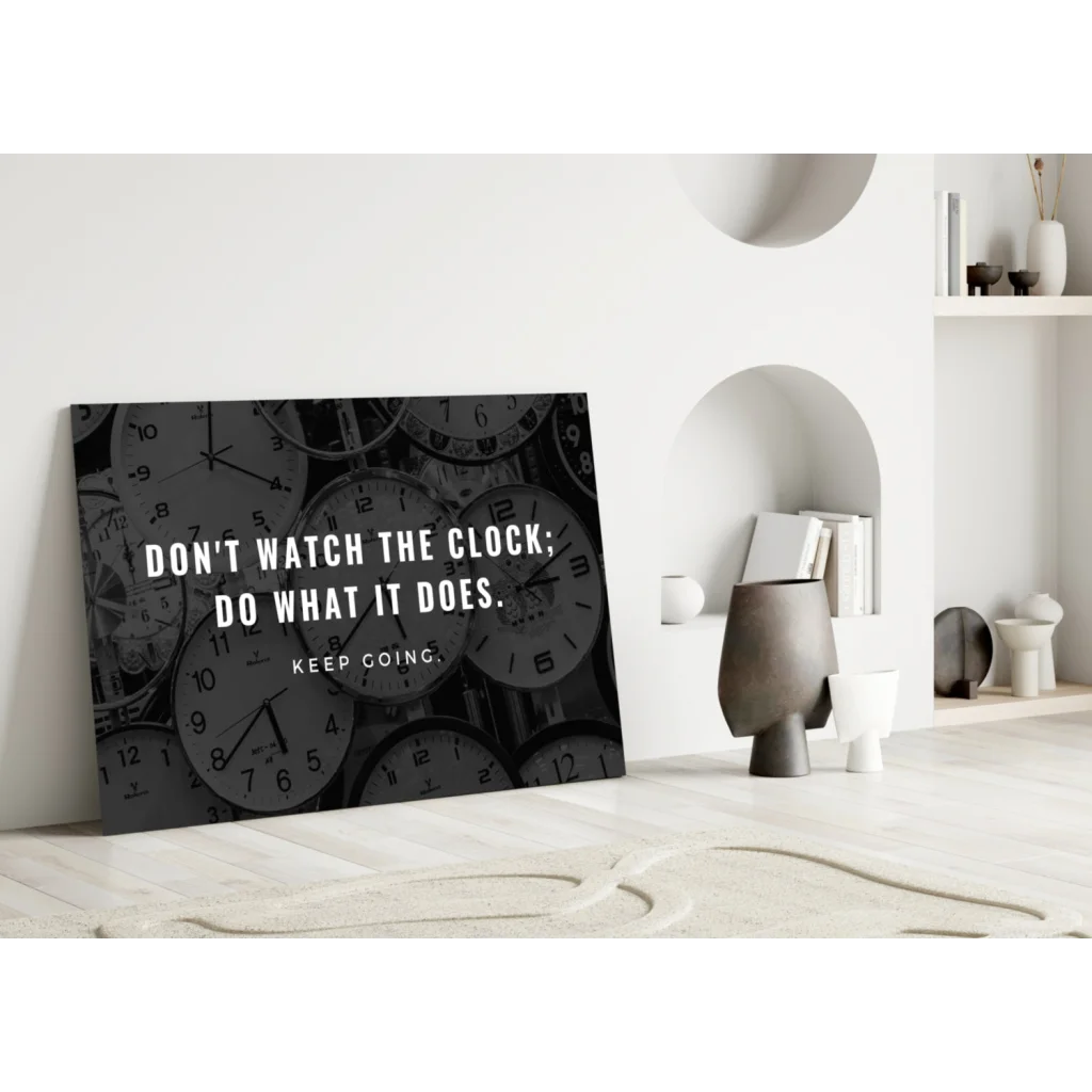 Black glass wall art print with overlapping clocks and motivational quote