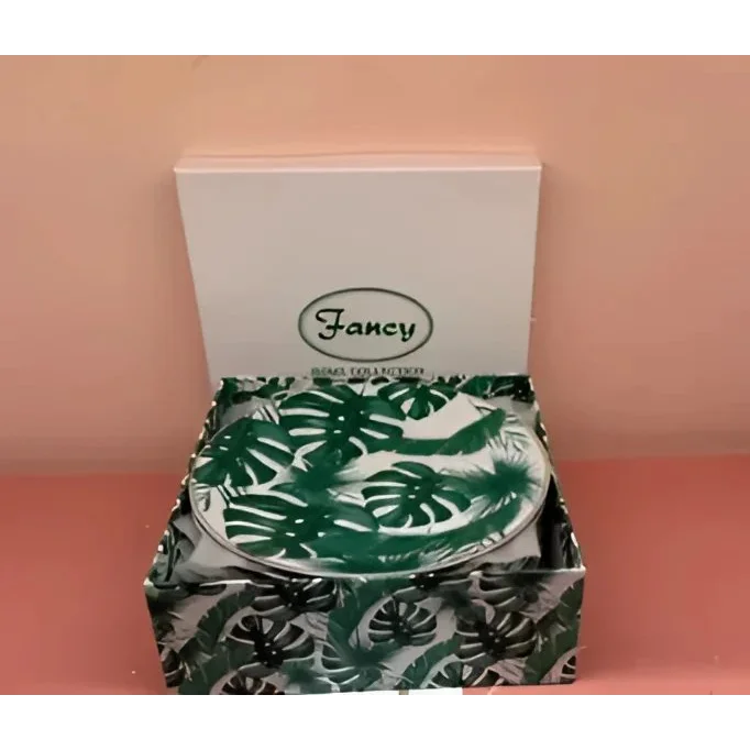 Open box of Fancy Home Collection dessert plates with green Monstera leaf patterns