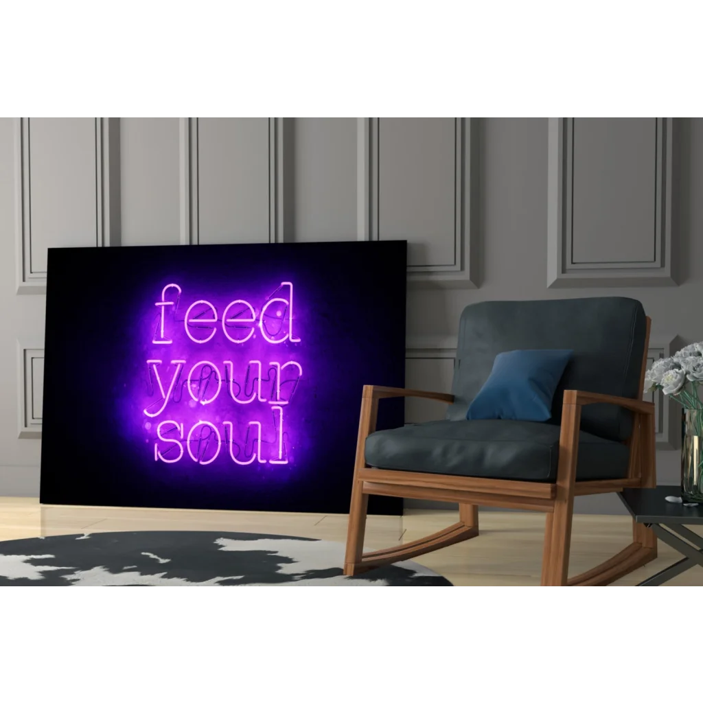 Purple neon Feed Your Soul glass wall art sign on black background