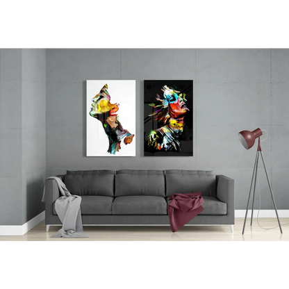 Two vibrant abstract glass wall art paintings on gray wall with bold brushstrokes