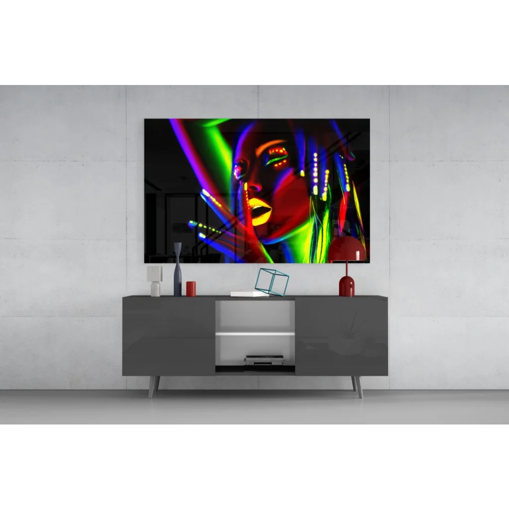 Vibrant neon glow glass wall art portrait above gray console