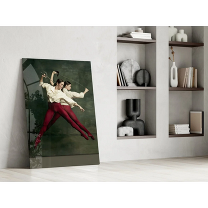 Tall glass wall art print of leaping dancers on dark green backdrop