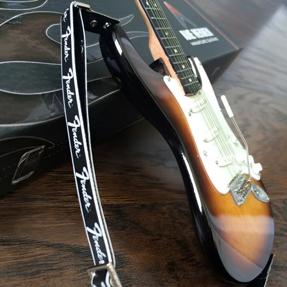 3-color sunburst Axe Heaven mini guitar with Fender logo strap