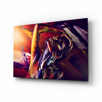Vibrant fiery abstract figure canvas wall art in bold swirling red, orange, purple, gold hues