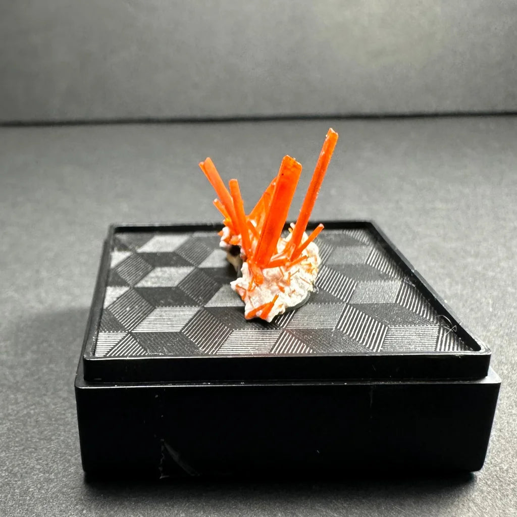 Vibrant fiery orange crocoite crystal spikes from Tasmania Australia