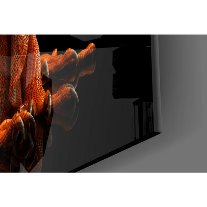 Fiery orange iguana glass wall art with detailed dragon claw on black canvas