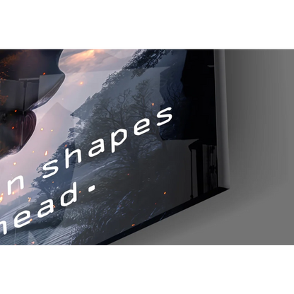 Sleek black-framed glass wall art of fiery mountain with quote on TV