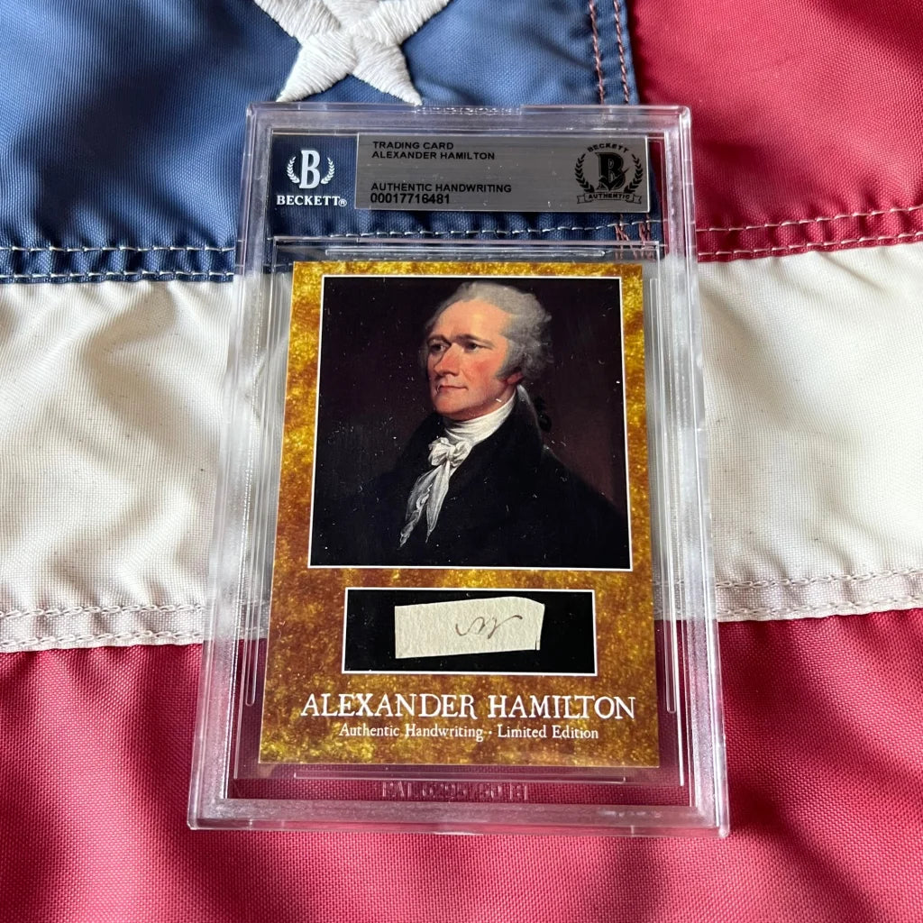 A golden limited edition beckett graded Alexander Hamilton trading card featuring Hamilton handwriting and words encased in slab