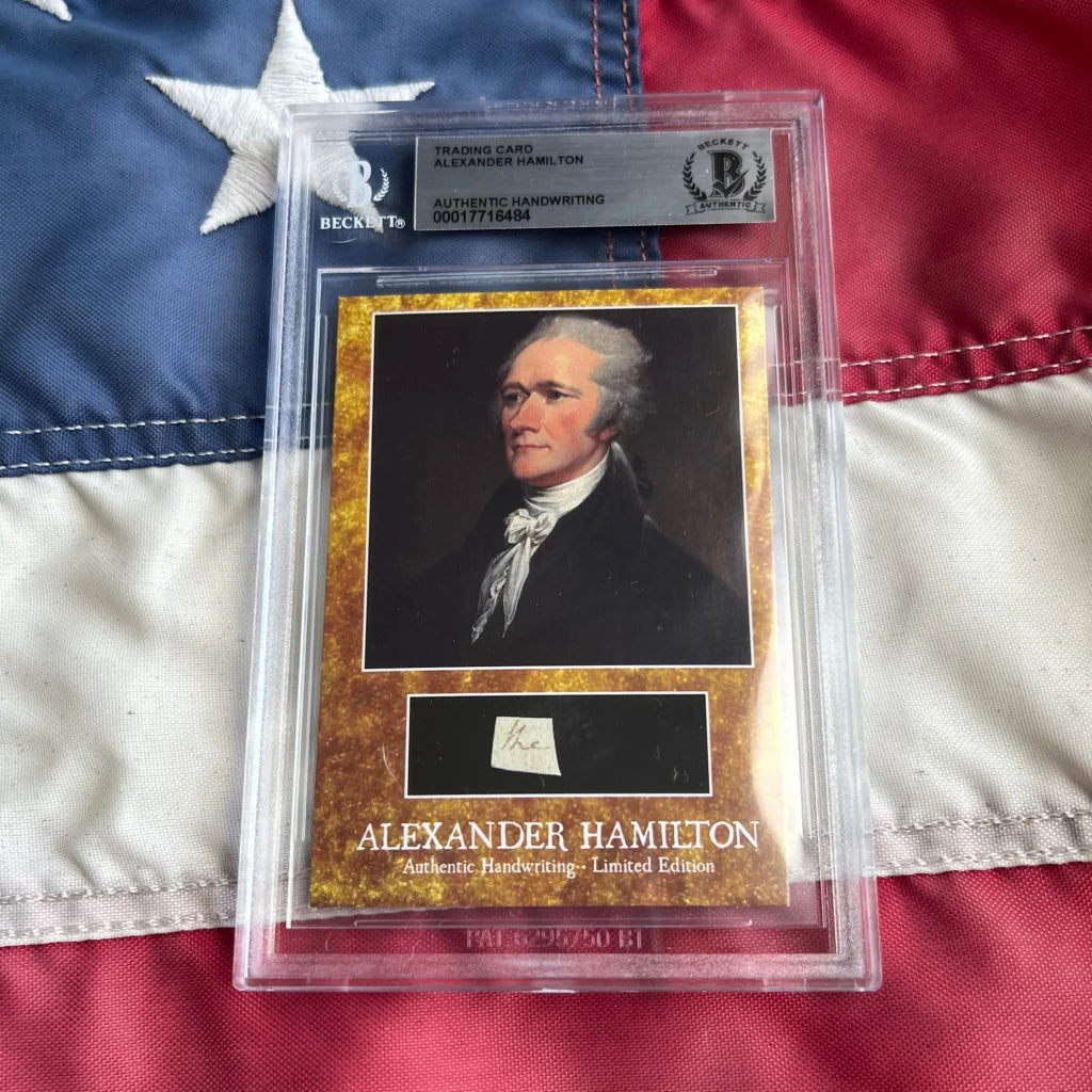 A framed beckett graded alexander hamilton words trading card with authentic hamilton handwriting in clear protective packaging