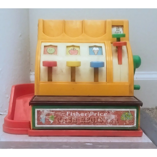 Vintage 1974 Fisher Price cash register toy in yellow and red with colorful buttons