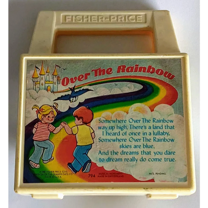 Vintage Fisher Price rainbow music box toy with kids illustrations